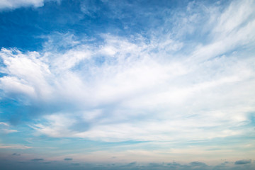 Evening light with clouds and blue sky.
