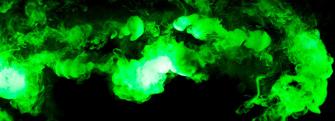 fusion of green smoke in motion isolated on black background