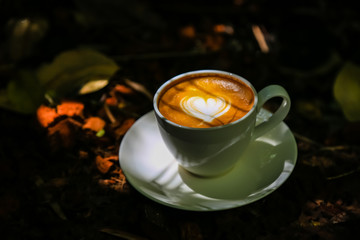 Latte coffee on low light wood floors Natural light for design or background work