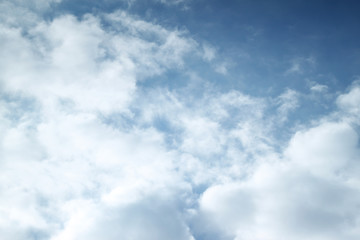 Sky blue background with white clouds