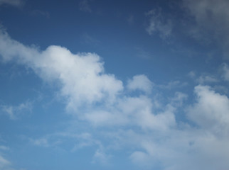Sky blue background with clouds