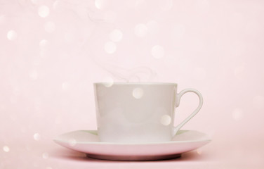 cup of coffee in the morning with bokeh in pink