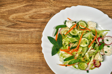 Spring salad of cucumbers and cabbage . Healthy eating concept