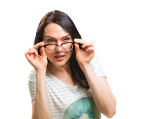 Woman with her glasses lifted up can't see