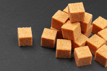 Rock sugar on dark background close up