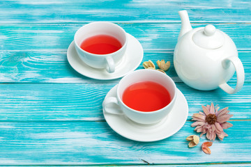 healthy herbal tea over blue background