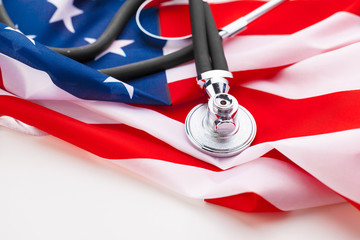 Stethoscope on American national flag, close up