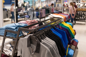 Minsk, Belarus - May 29, 2019: interior shot of racks with shirts and undershirts