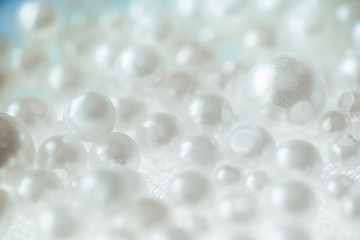 White Pile of pearls and beads  on the background
