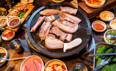 Pan-fried cooked black pork meal in Korea restaurant, fresh delicious korean food cuisine on iron...