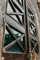 wooden elements on the doors of an old wooden building