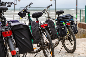 Fototapeta na wymiar Tourist trekking bikes parked close to the beach and sea.