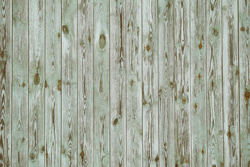 Background texture of old gray green painted wooden lining boards wall. Vertical wooden texture. Toned image.