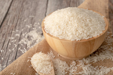 Rice in a brown bowl on the wooden table