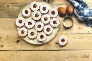 Traditional algerian cookies with apricot jam on rustic wooden. Holiday concept