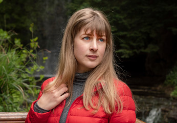 Fototapeta premium Portrait shot of a young 25 year old woman in the nature - travel photography