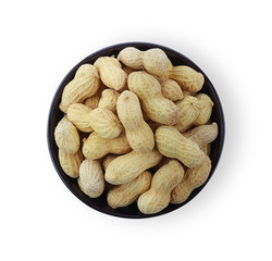 Dry peanuts in a black cup isolate on a white background. Top view.