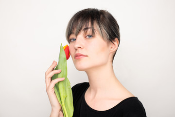 Beautiful girl with tulip flower