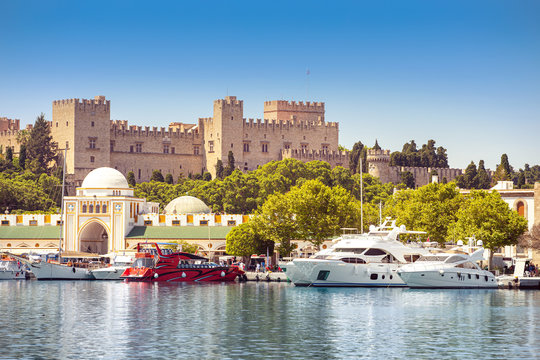Rhodes old fortress cityscape with sea port at foreground. Travel destinations in Greece