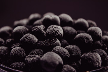 black frozen berries in a glass