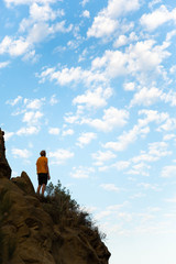Man standing alone at mountains Looking at sky Travel Lifestyle spiritual relaxation emotional...