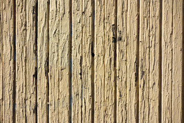 Texture of wooden horizontal old yellow threadbare boards