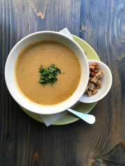 Delicious cream soup for lunch served with croutons