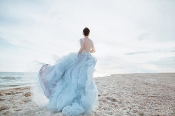 Running bride on the beach