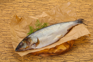 Salted herring over the wooden board