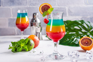 Summer rainbow layered cocktail