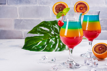 Summer rainbow layered cocktail