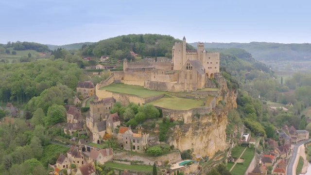 Vertical flight over Dordogne river to see Beynac et Cazenac medieval village, Aquitanie, Southern France