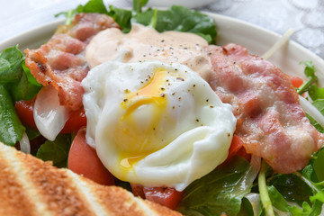 breakfast with bacon salad, egg and toasted bread