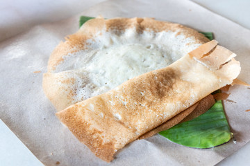 Penang famous apom manis, Served on banana leaf.