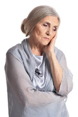 Portrait of sad senior woman posing isolated on white background