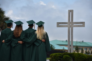 Graduates with cross