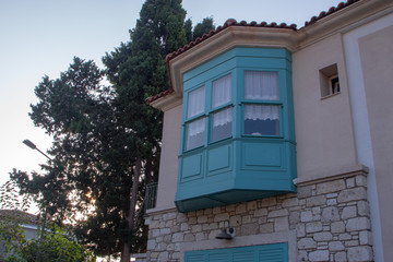 blue balcony and windows made from wood 