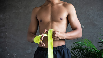 The trainer wrapping hand with yellow mitt,prepare for punching practice