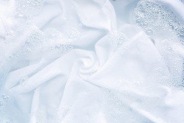 Soak a cloth before washing, white cloth.