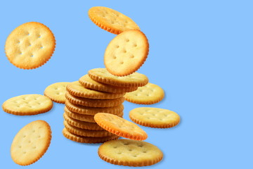 Top view of round salted snack cracker cookie isolated on blue background