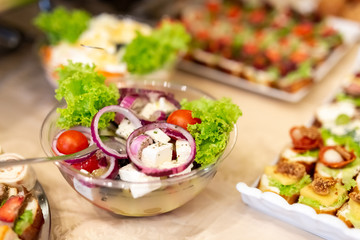 Fresh vegetarian salad in bowl on table.