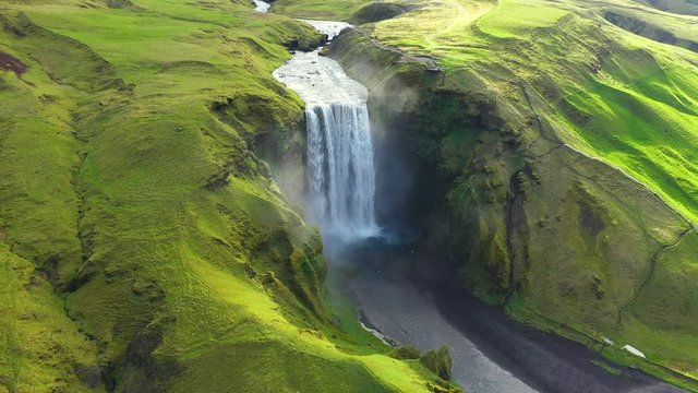 Flying Above Skogafoss Waterfall in Iceland, Water Coming From the Melting Glacier of Eyjafjallajokull Volcano One of the Country's Most Famous Tourist Attractions. 4k aerial drone view