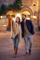 Couple in love, enjoying in evening walk together .