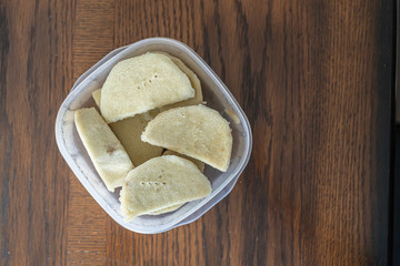 Nigerian boiled yam in plastic container