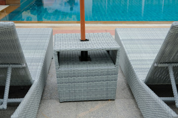 wicker rattan pool sun bed deckchair at swimming pool