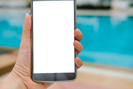 Hand Holding Smart Phone Near Swimming Pool