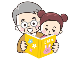 Obraz premium 絵本を読む祖父と孫