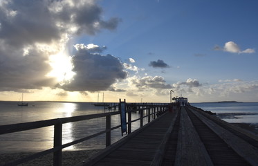The Kingfisher Bay ferry departs Fraser Island at sunset. World Heritage-listed Fraser Island is the world’s largest sand island.