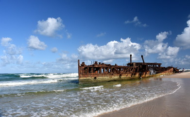 The rusty wreck of the vessel Maheno on the shores of Fraser Island (Queensland, Australia). The...