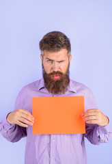 Serious bearded man holding advertising board. Advertising and sale. Online shopping. Advertising banner. Seasons sale. Discount. Marketing. Add. Copy space for text.